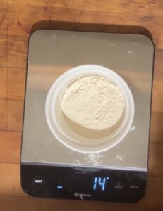 Put flour on your scale and zero out the scale